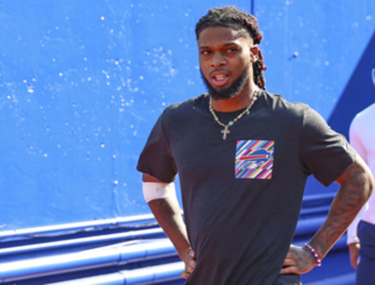 Damar Hamlin in Buffalo Bills uniform walking onto football field before game