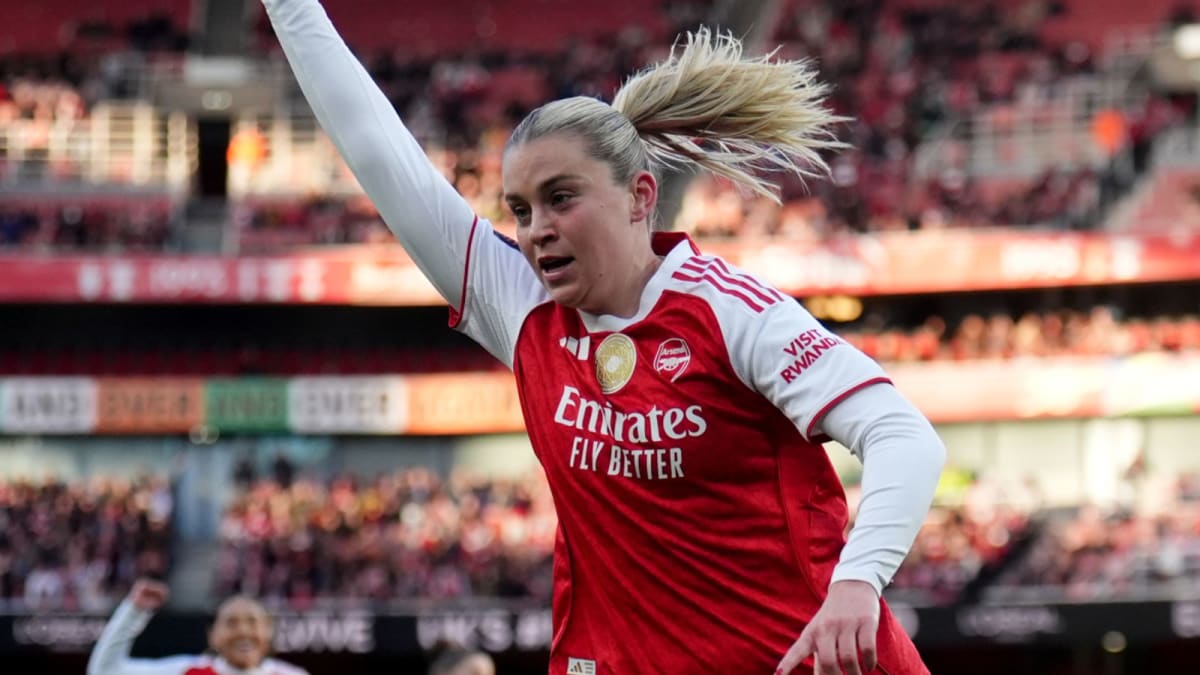 Alessia Russo celebrates hat-trick goal with Arsenal teammates at packed Emirates Stadium