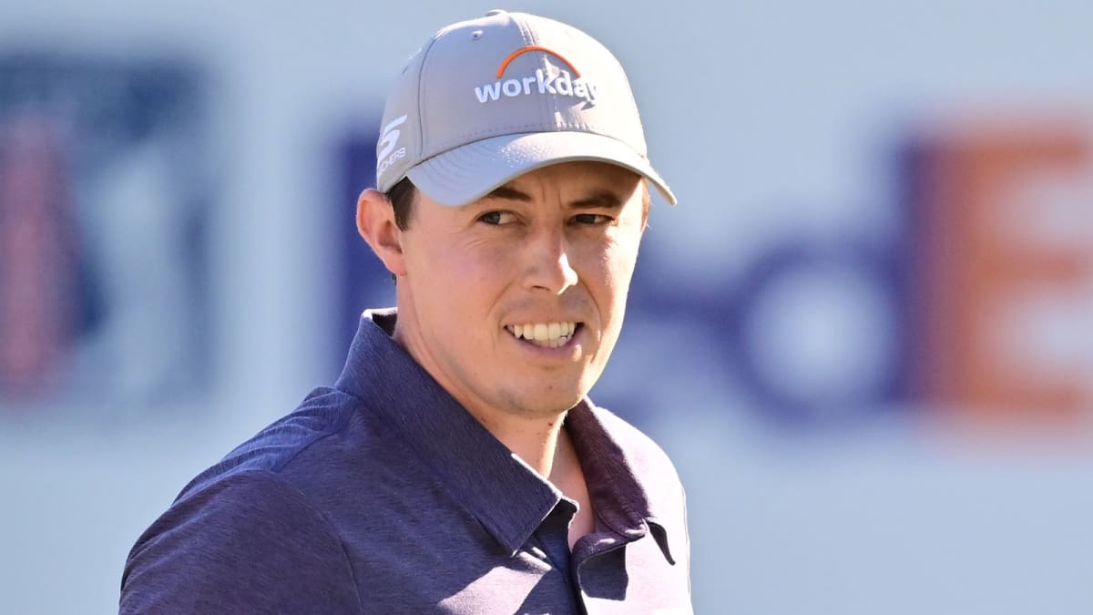 Matt Fitzpatrick celebrating with arms raised after sinking winning putt at Valspar Championship