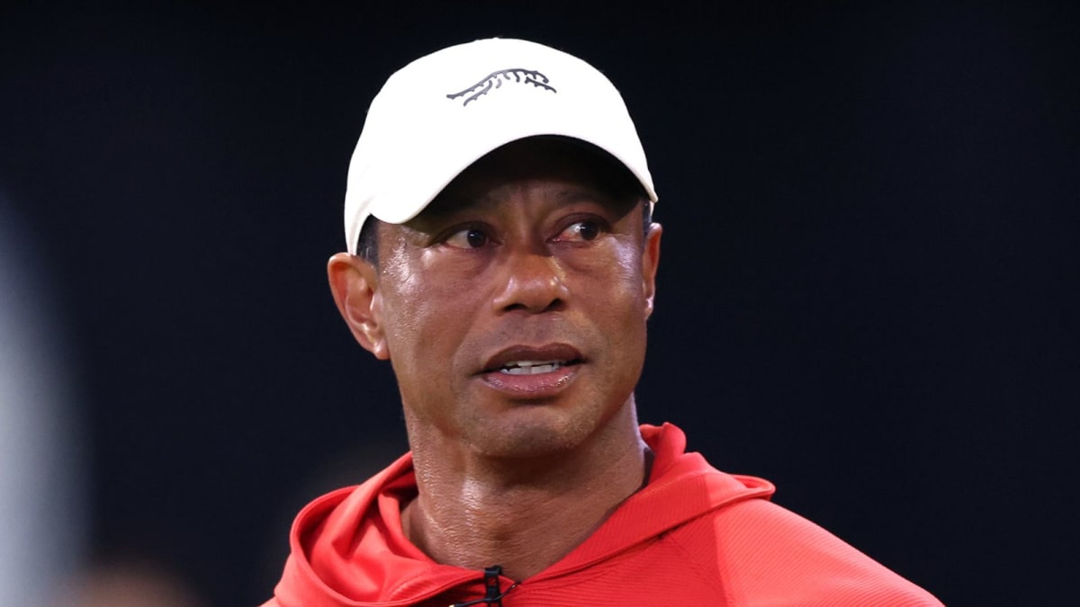 ** Tiger Woods in Jupiter Links team gear preparing to return to competitive golf