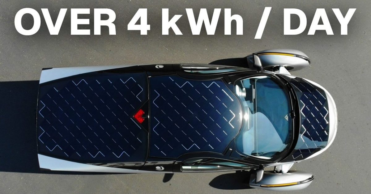 Teardrop-shaped Aptera solar electric vehicle with curved body covered in integrated solar panels