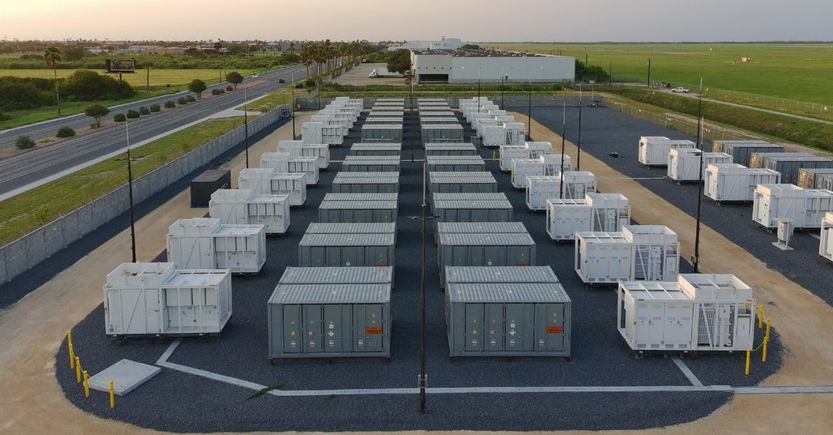 Large white battery storage facility in South Texas with blue sky background