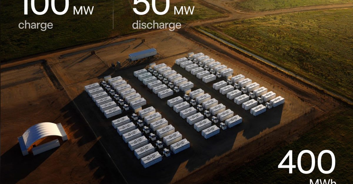 Large white Tesla Megapack battery units installed at solar farm in rural Australia