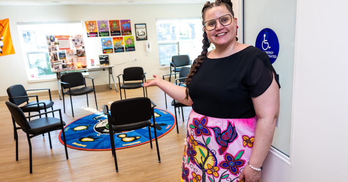 Indigenous health consultant Katrina Graham standing inside the bright, welcoming Manitou Wiigwaam Spirit Lodge healing space