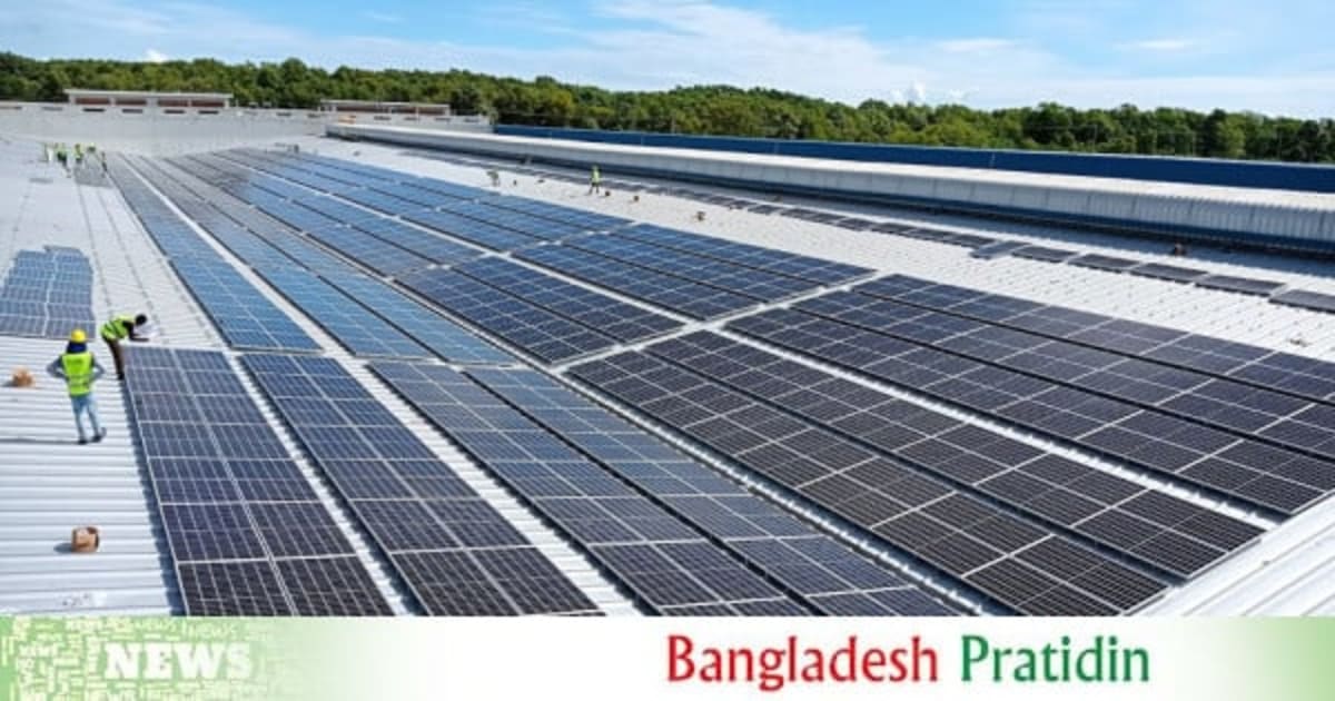 Solar panels installed on industrial rooftop in Bangladesh under bright sunlight
