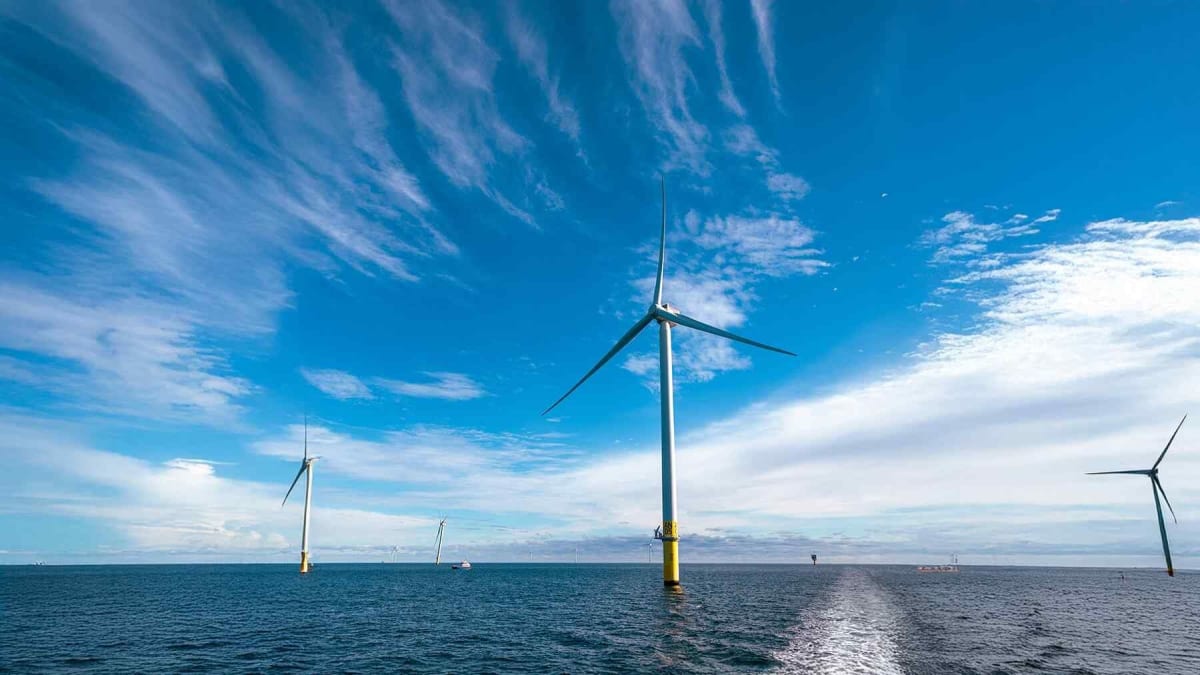 Offshore wind turbines spinning in the German North Sea generating renewable energy