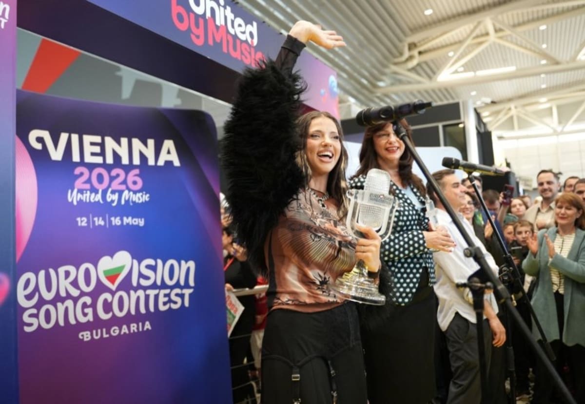 DARA holding Eurovision trophy while celebrating Bulgaria's first historic contest victory in 2026