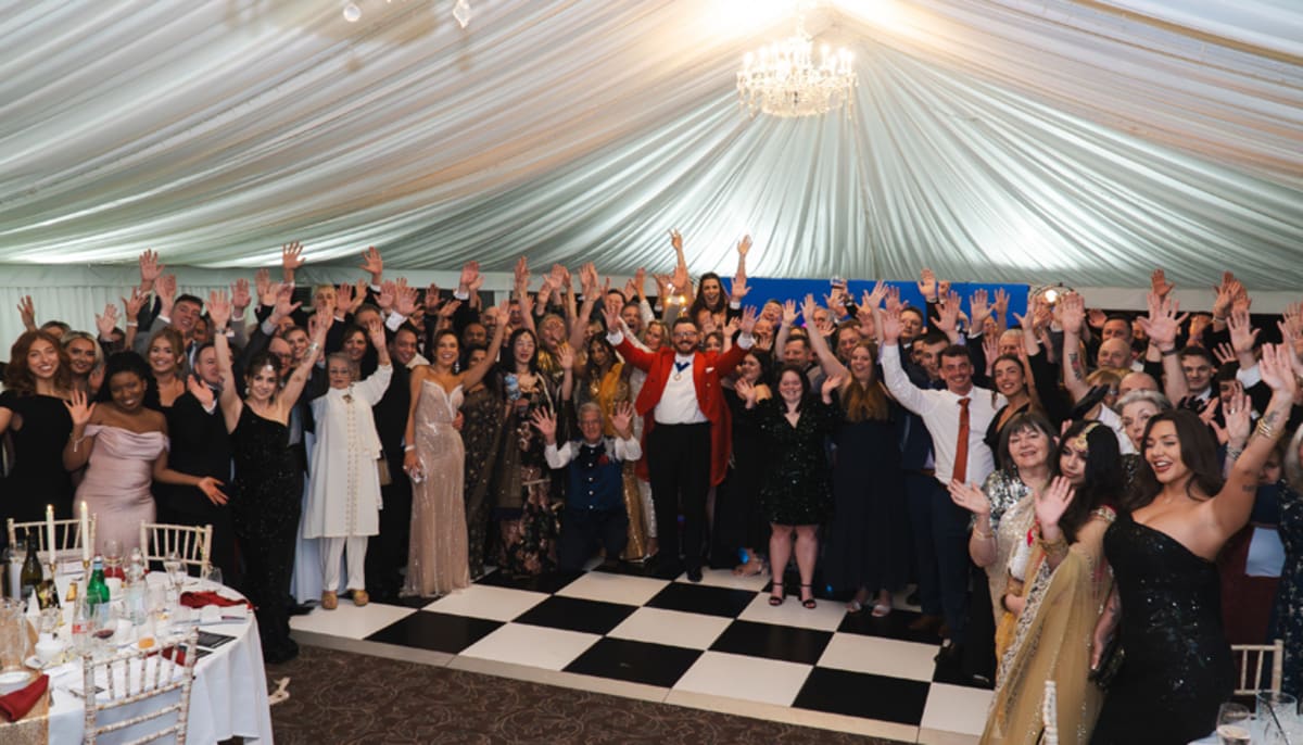 Guests at formal charity gala celebrating fundraising success for breast cancer support organization