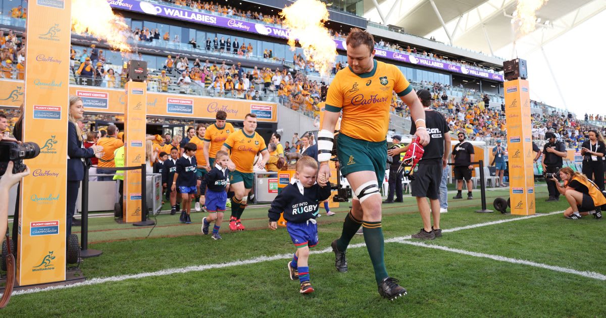 Wallabies rugby players running onto field at Queensland Country Bank Stadium in Townsville Australia