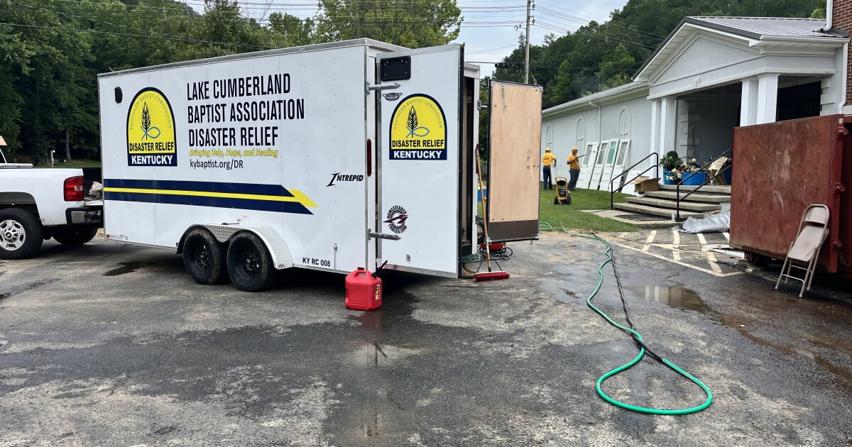 Disaster relief volunteers cleaning flood damaged church basement in McKee Kentucky