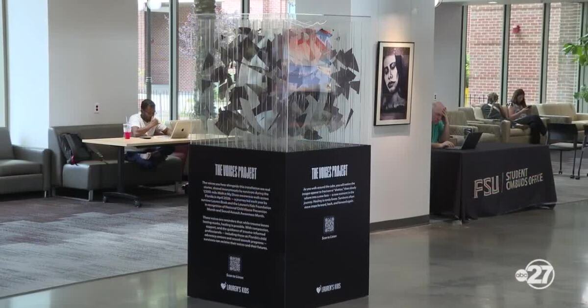 Seven-foot plexiglass sculpture with multiple transparent panels inside Florida State University Student Union