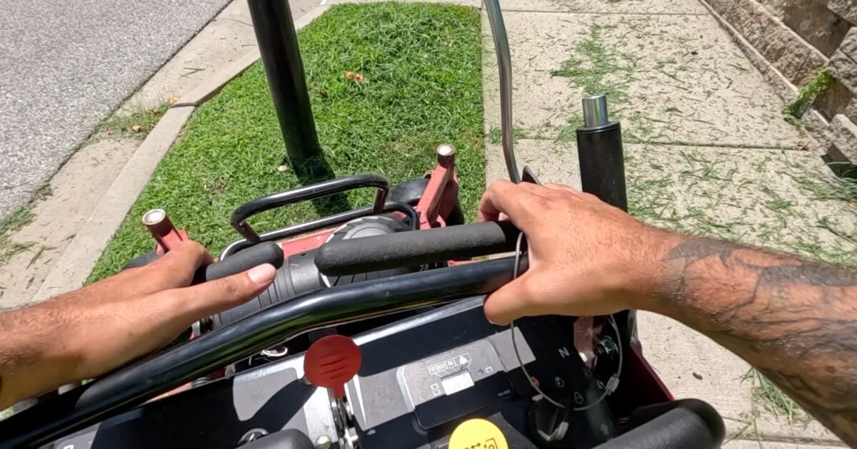 Volunteer mowing lawn for elderly resident through Shawnee Kansas community program