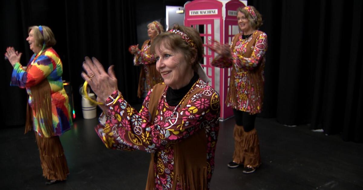 Rita Taylor in silver costume performing with The Divas troupe at Temple Theatre rehearsal
