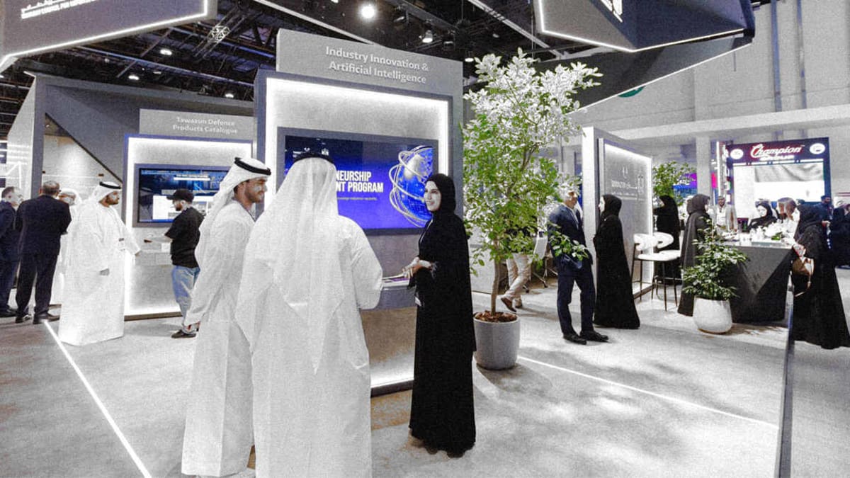 ** Modern defense technology facility in UAE with entrepreneurs collaborating on innovative security solutions