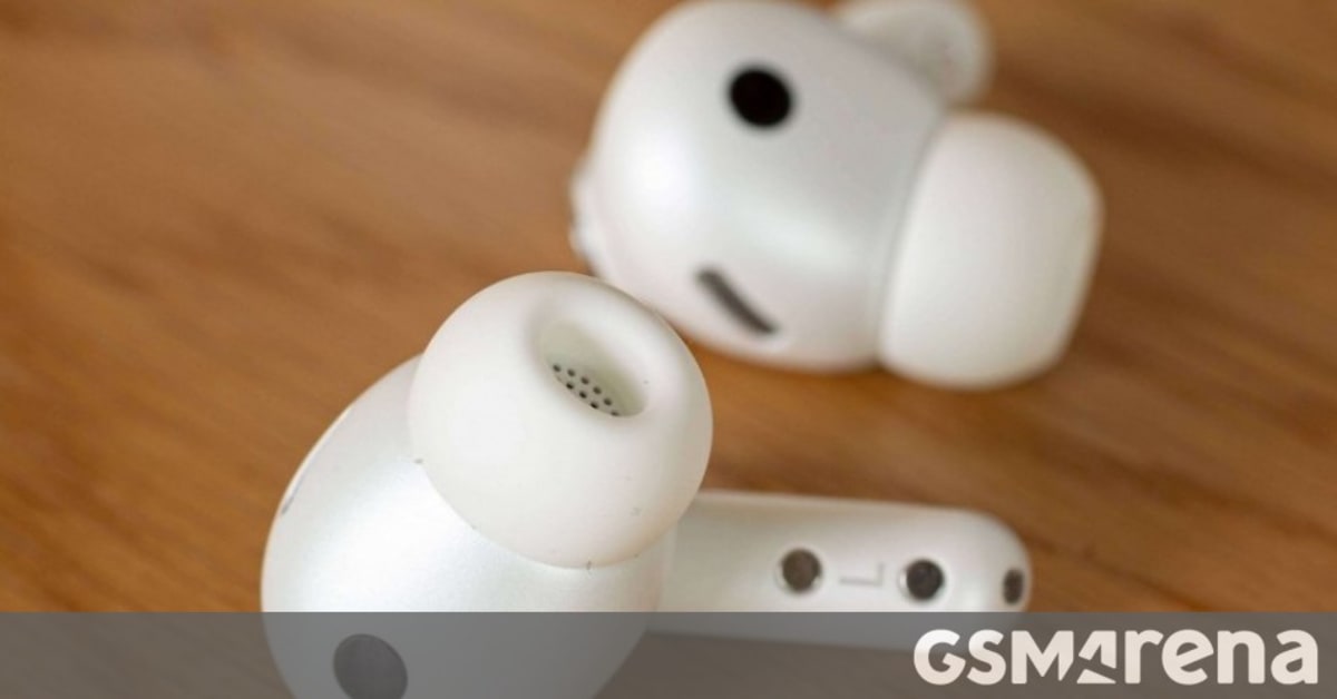 Person wearing earbuds while sitting comfortably in a moving vehicle using smartphone app