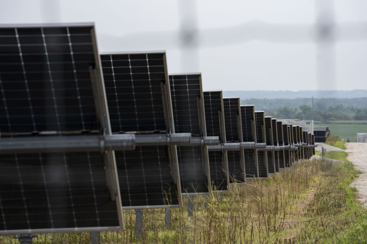 Wind turbines stand tall across Nebraska farmland generating clean energy and tax revenue