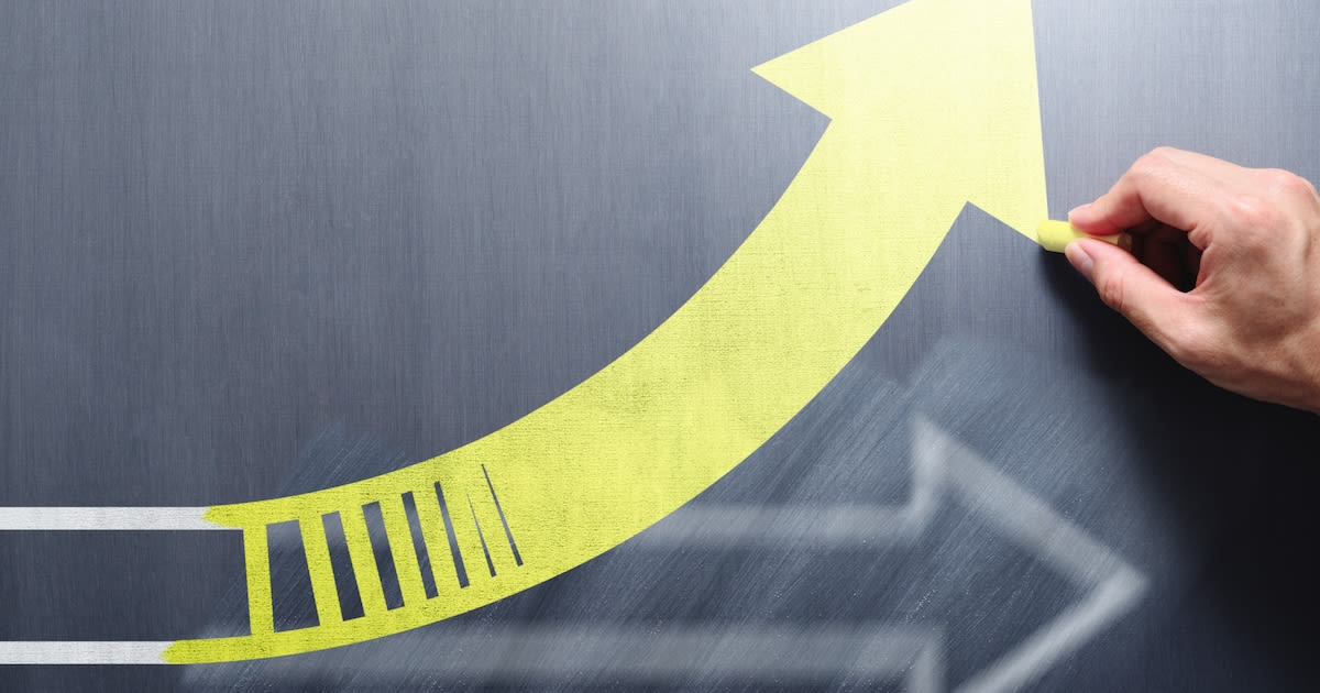 Student working one-on-one with teacher in classroom receiving individualized educational support and instruction