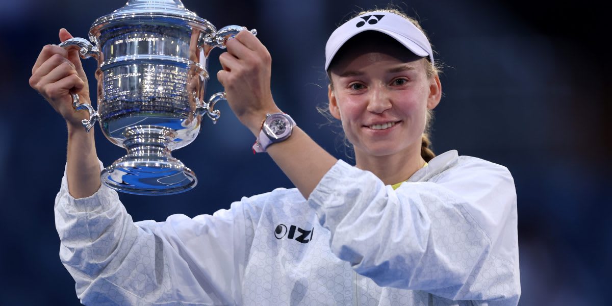 Elena Rybakina holding U.S. Open trophy after defeating Aryna Sabalenka in championship match