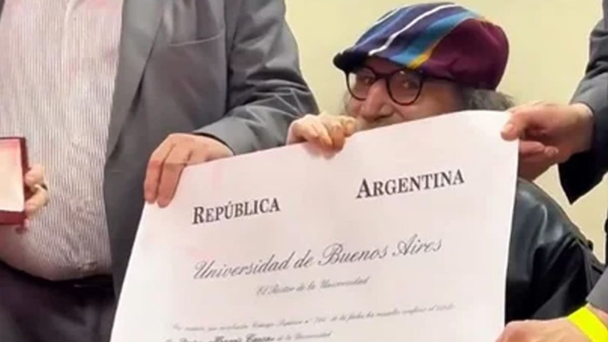 Argentine rock legend Charly García smiling at a cultural event in Buenos Aires