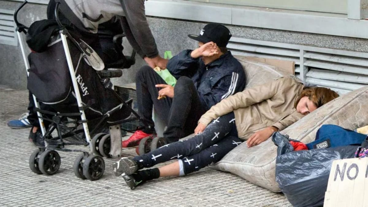 ** Busy street market in Buenos Aires with families shopping for produce and goods