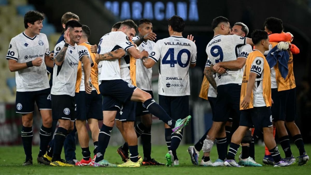 Independiente Rivadavia soccer players celebrating victory on field in Mendoza Argentina