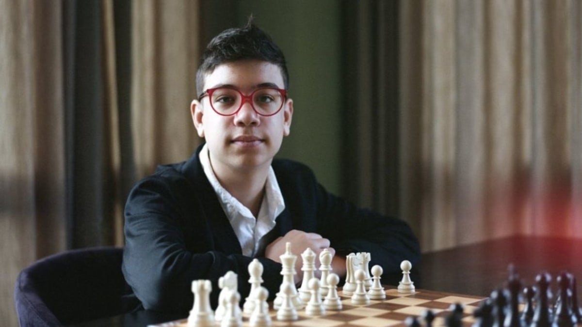 Young chess prodigy Faustino Oro concentrating during a competitive chess tournament match