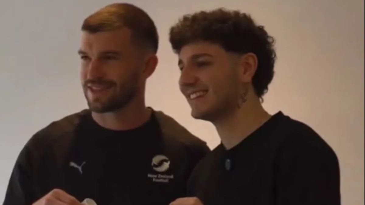 New Zealand footballer Tim Payne holding team shirt with Argentine influencer Valen Scarsini at training camp