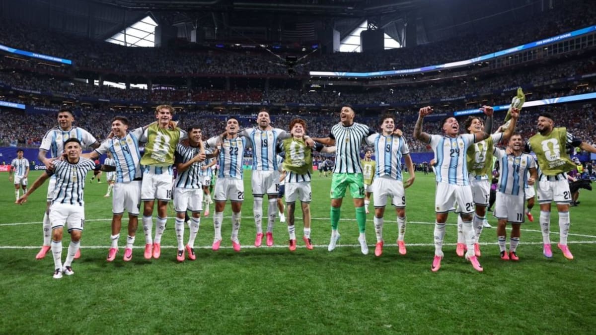 ** Argentine soccer players celebrating together in locker room singing fan anthem after World Cup victory