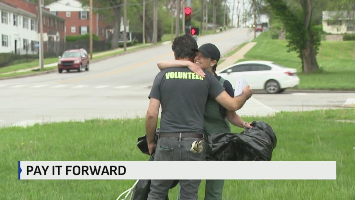 Dedicated volunteer picking up litter in Kansas City park to keep community clean