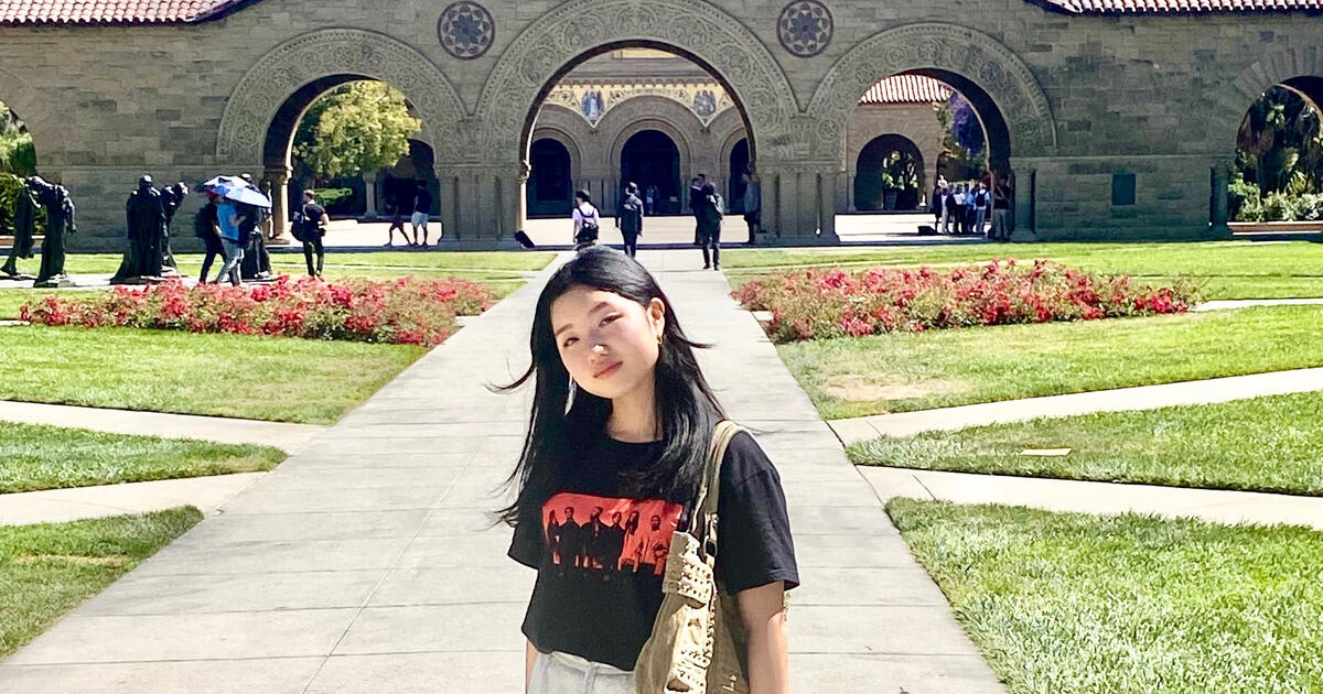 Japanese high school student Minami Ohno standing in front of Stanford Memorial Church during summer program
