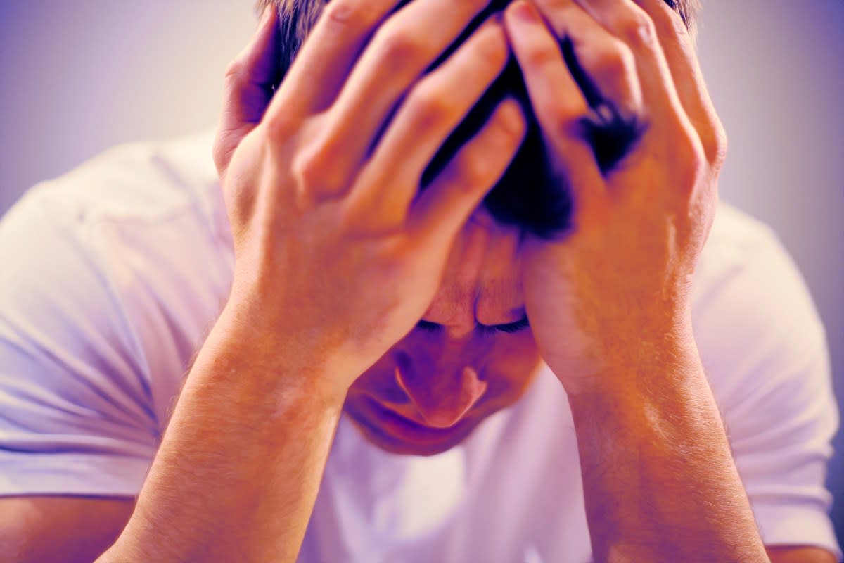 Person using smartphone with ChatGPT interface, showing mental health support and safety features