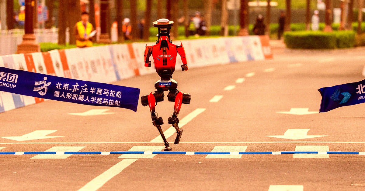Humanoid robot running on outdoor track during Beijing half marathon competition