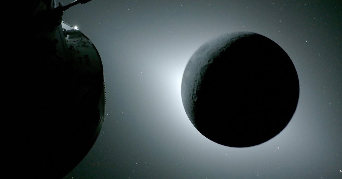 Earth rising above Moon's cratered surface as seen from Artemis 2 spacecraft