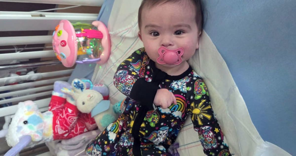Eight-month-old baby Nova Vega recovering in hospital after emergency CPR and heart surgery