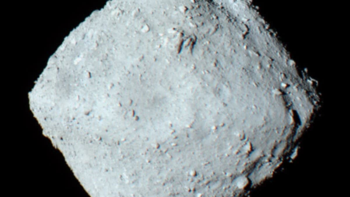 Microscope image of dark rocky samples collected from asteroid Ryugu by spacecraft