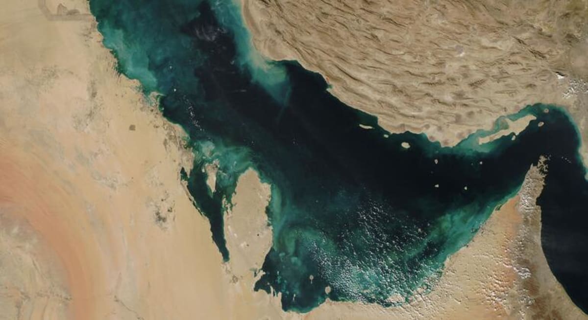 Satellite view of the Strait of Hormuz showing the narrow waterway between Iran and Oman