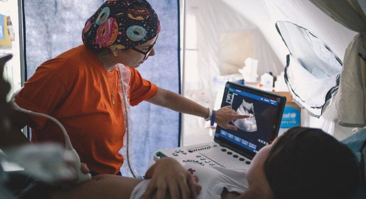 Pregnant woman receives medical care at temporary shelter after surviving Venezuelan earthquake