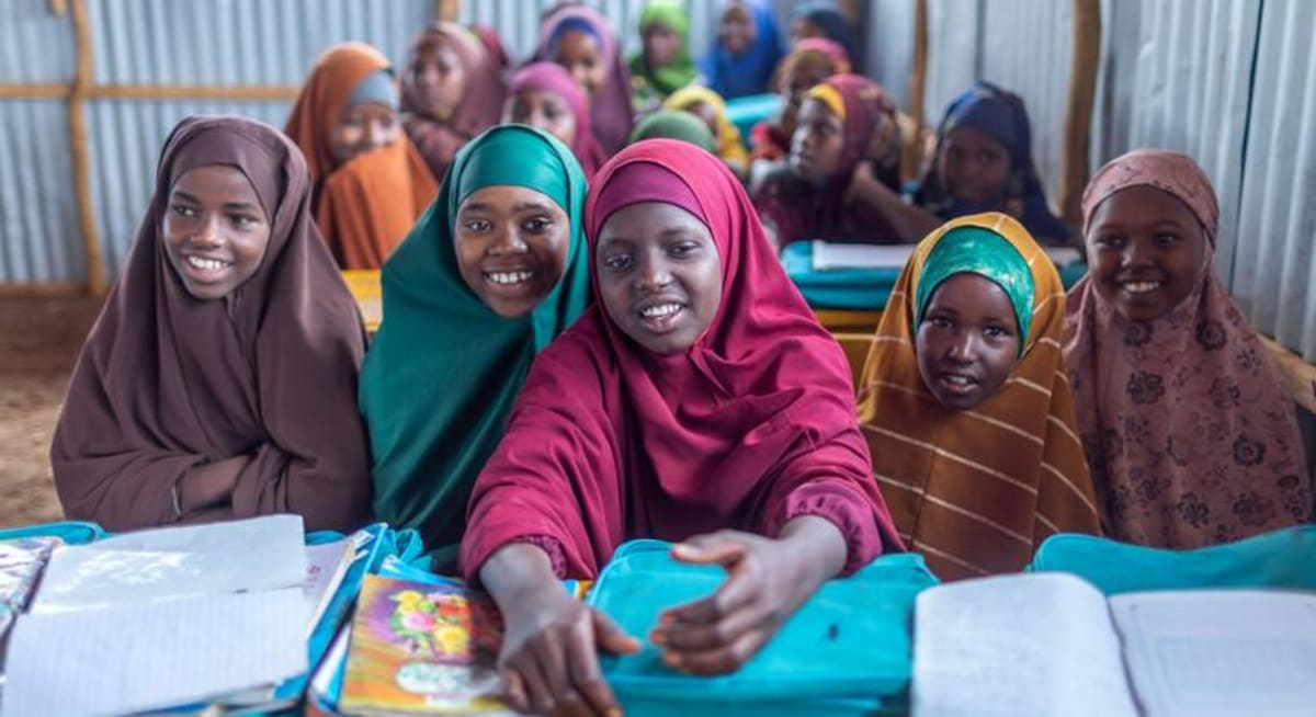 Girls studying at desks in a school for displaced children in Baidoa, Somalia