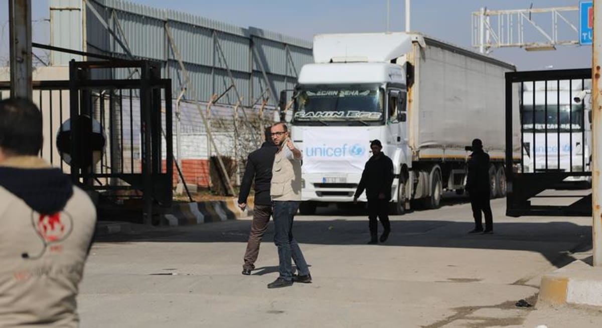 Humanitarian aid trucks crossing from Turkey into northwest Syria carrying essential supplies
