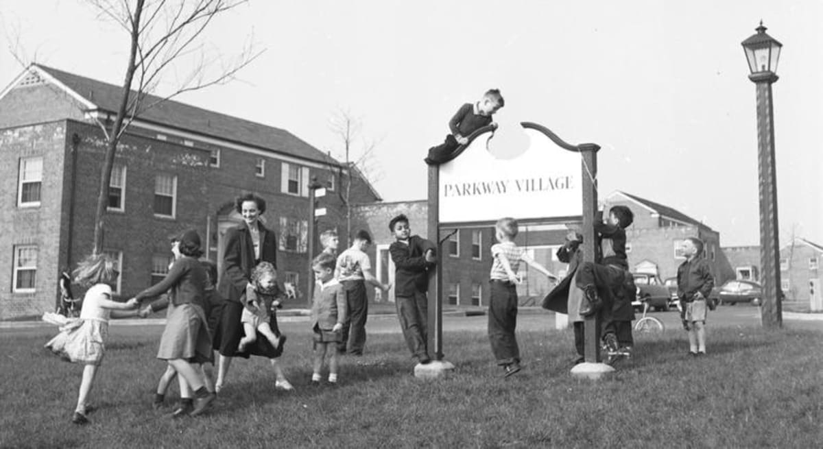 Children from diverse backgrounds playing together at Parkway Village housing development in 1950