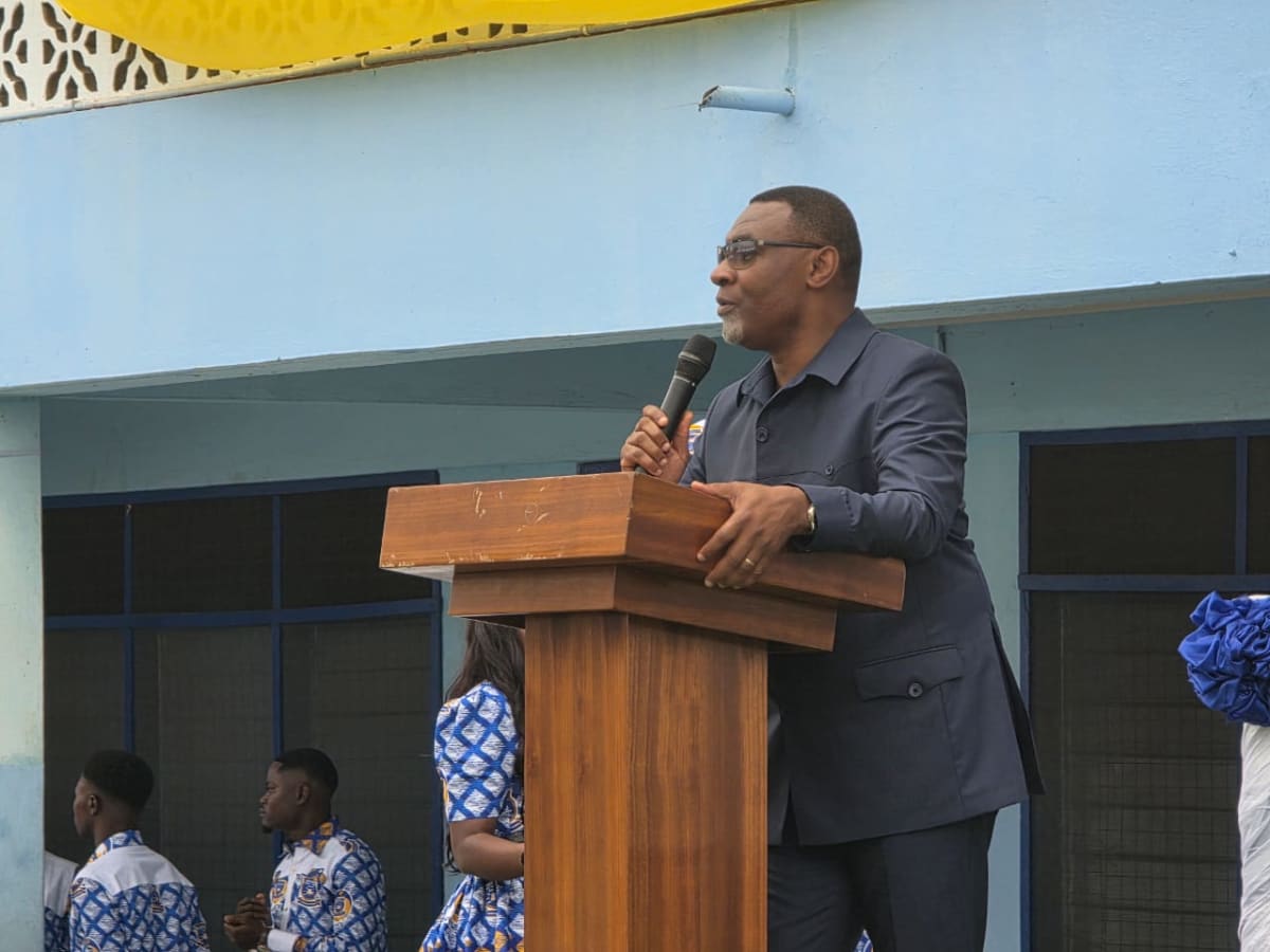 ** Reverend Lawrence Tetteh speaking at Harrow International School's 60th anniversary celebration in Accra, Ghana