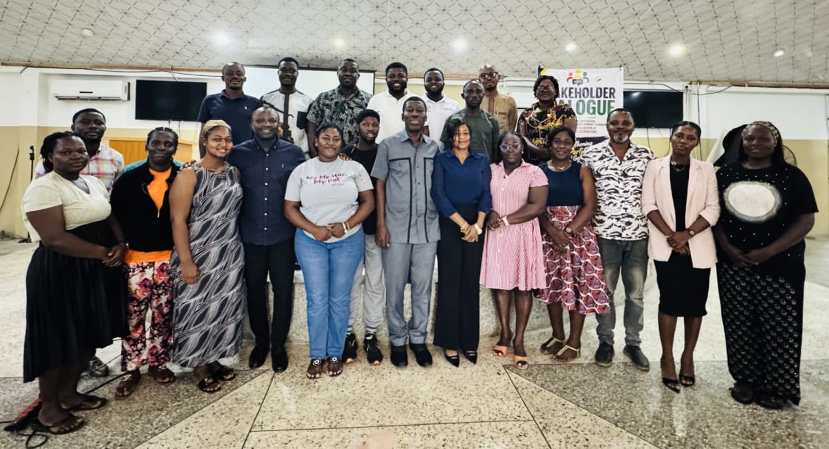 Young people and government officials meeting together for community development dialogue in Ghana
