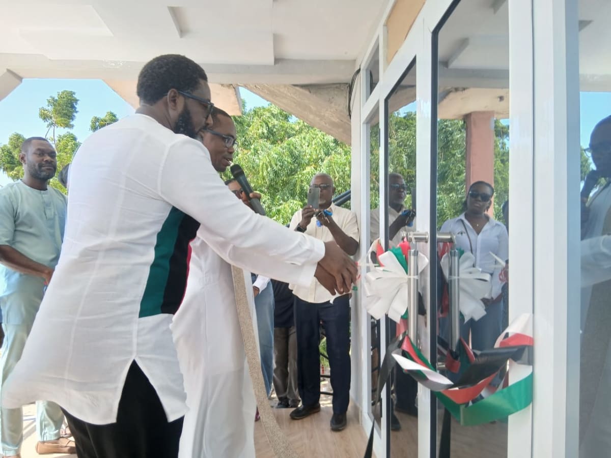 Lawyer Lom Nuku Ahlijah standing outside new constituency office in Adzido Ghana