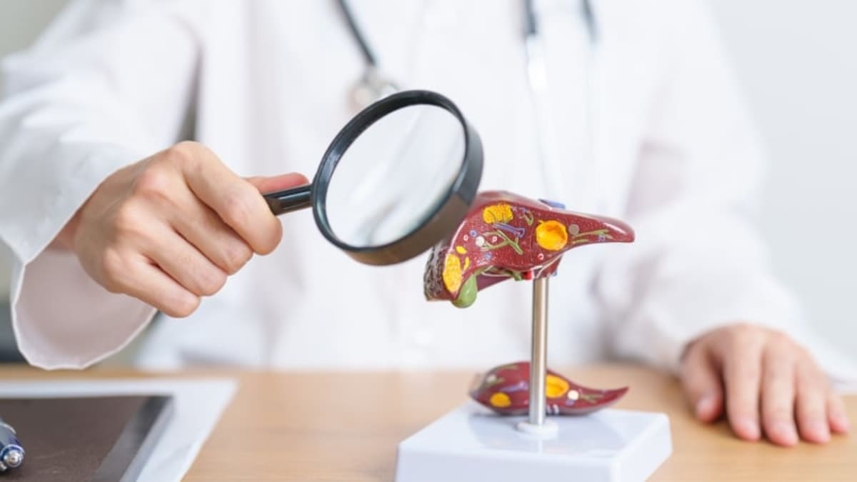 Medical researchers examining hepatitis B virus samples in modern laboratory setting