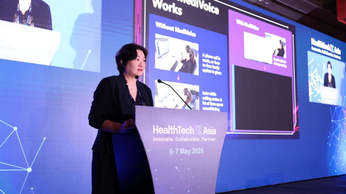 ** Chief Nurse Karen Koh presenting at healthcare technology conference in Singapore