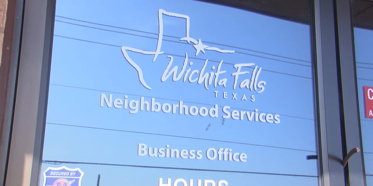 Volunteer mowing lawn for elderly homeowner in residential Wichita Falls neighborhood