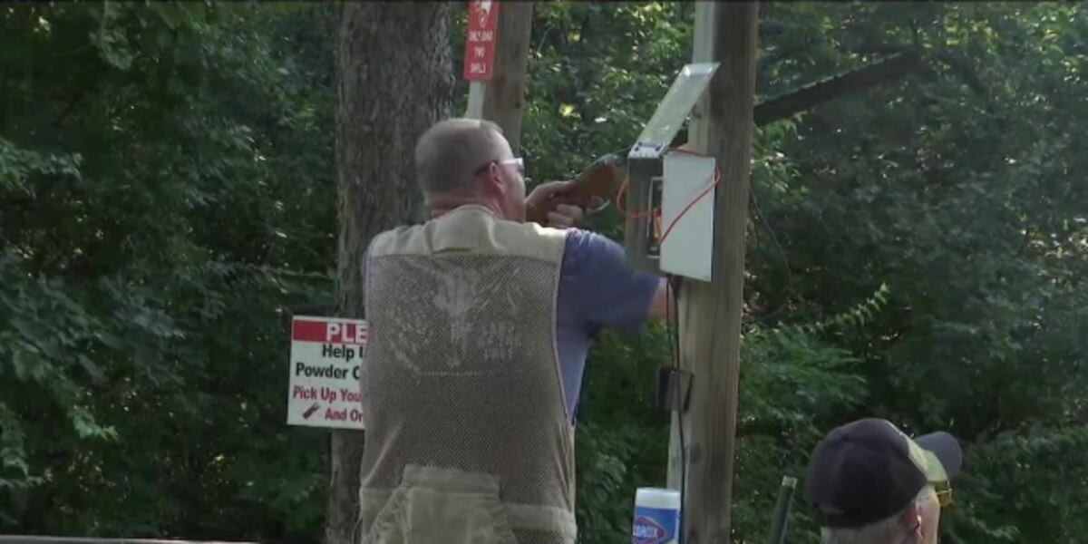 Community members at outdoor shooting range participating in cystic fibrosis fundraising event in Kansas