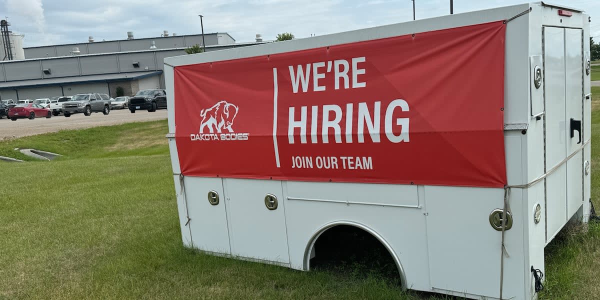 Modern truck manufacturing facility exterior with Dakota Bodies branding in Liberty, Missouri