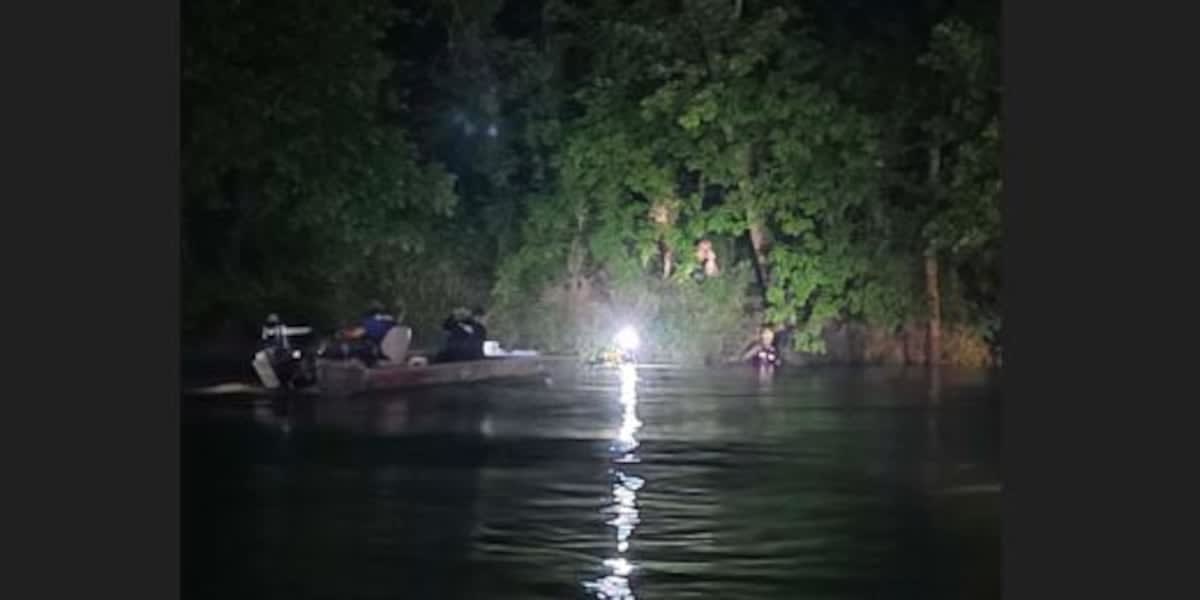 Emergency rescue teams working together during nighttime water rescue operation in Missouri