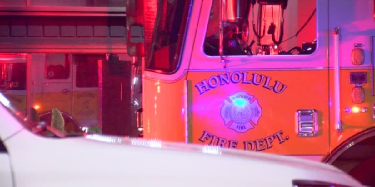 Honolulu Fire Department crew using hydraulic rescue tools at vehicle crash scene